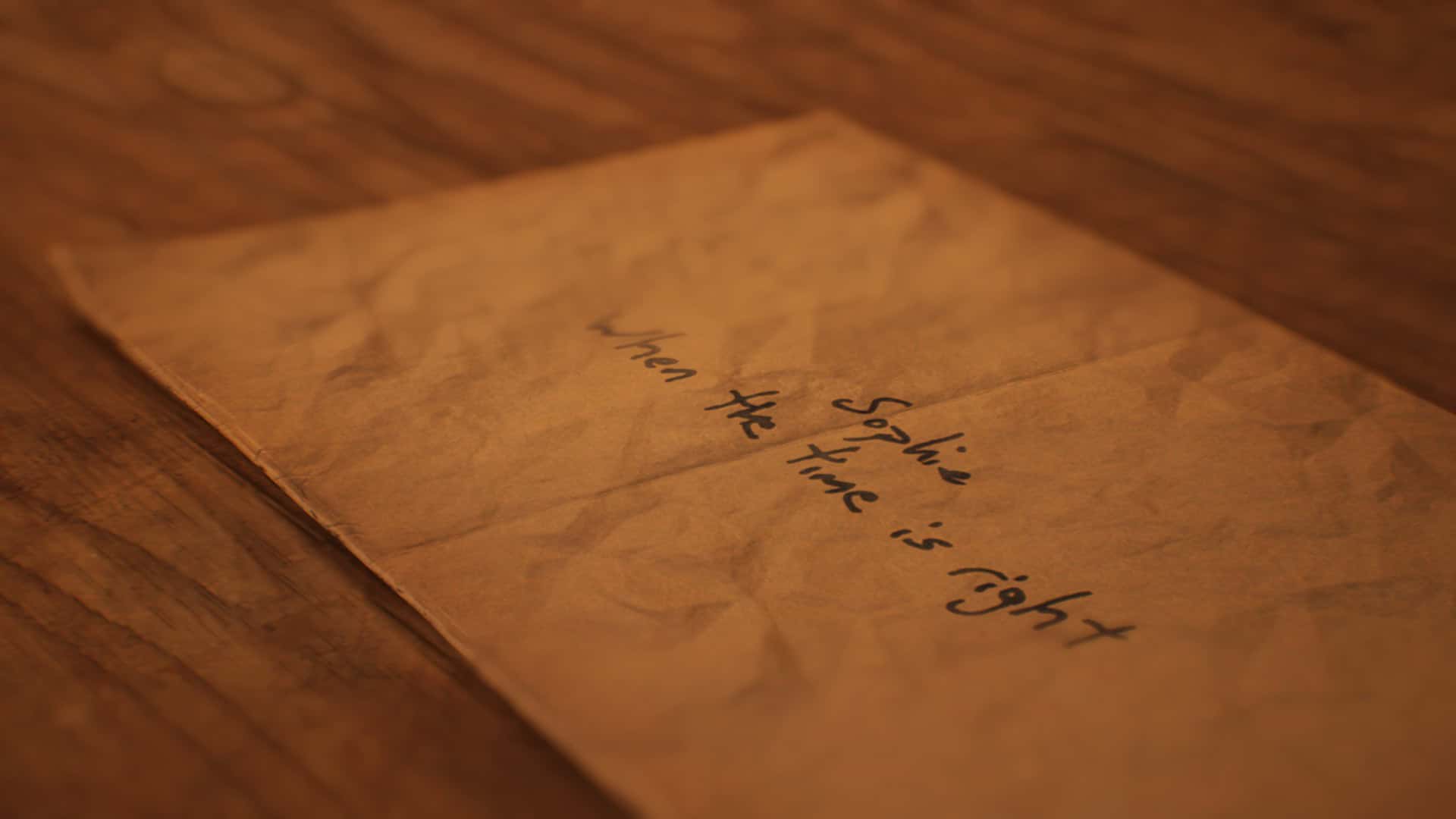 A paper envelope with the handwritten words "Sophie, when the time is right", from Lost & Found: A This Bed We Made Story.
