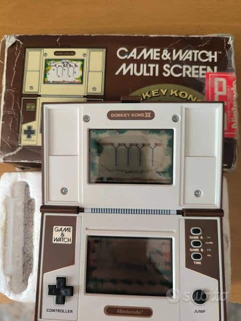 A Donkey Kong II Game & Watch Multi Screen in its original box, with screens and directional buttons visible.